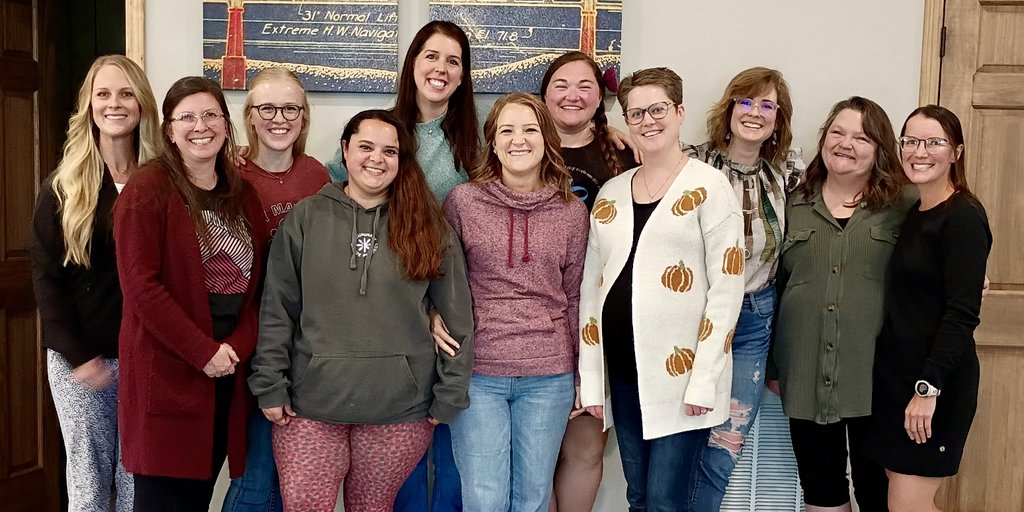 The ZoeCare team standing together and smiling.